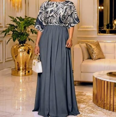 Two-tone maxi dress with a balloon/batwing sleeve and pleated A-line skirt.